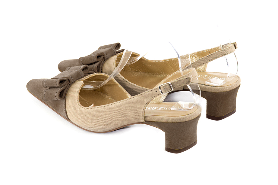 French elegance and refinement for these chocolate brown and tan beige dress slingback shoes, with a knot, 
                available in many subtle leather and colour combinations. The pretty French spirit of this beautiful pump will accompany your steps nicely and comfortably.
To be personalized or not, with your materials and colors.  
                Matching clutches for parties, ceremonies and weddings.   
                You can customize these shoes to perfectly match your tastes or needs, and have a unique model.  
                Choice of leathers, colours, knots and heels. 
                Wide range of materials and shades carefully chosen.  
                Rich collection of flat, low, mid and high heels.  
                Small and large shoe sizes - Florence KOOIJMAN